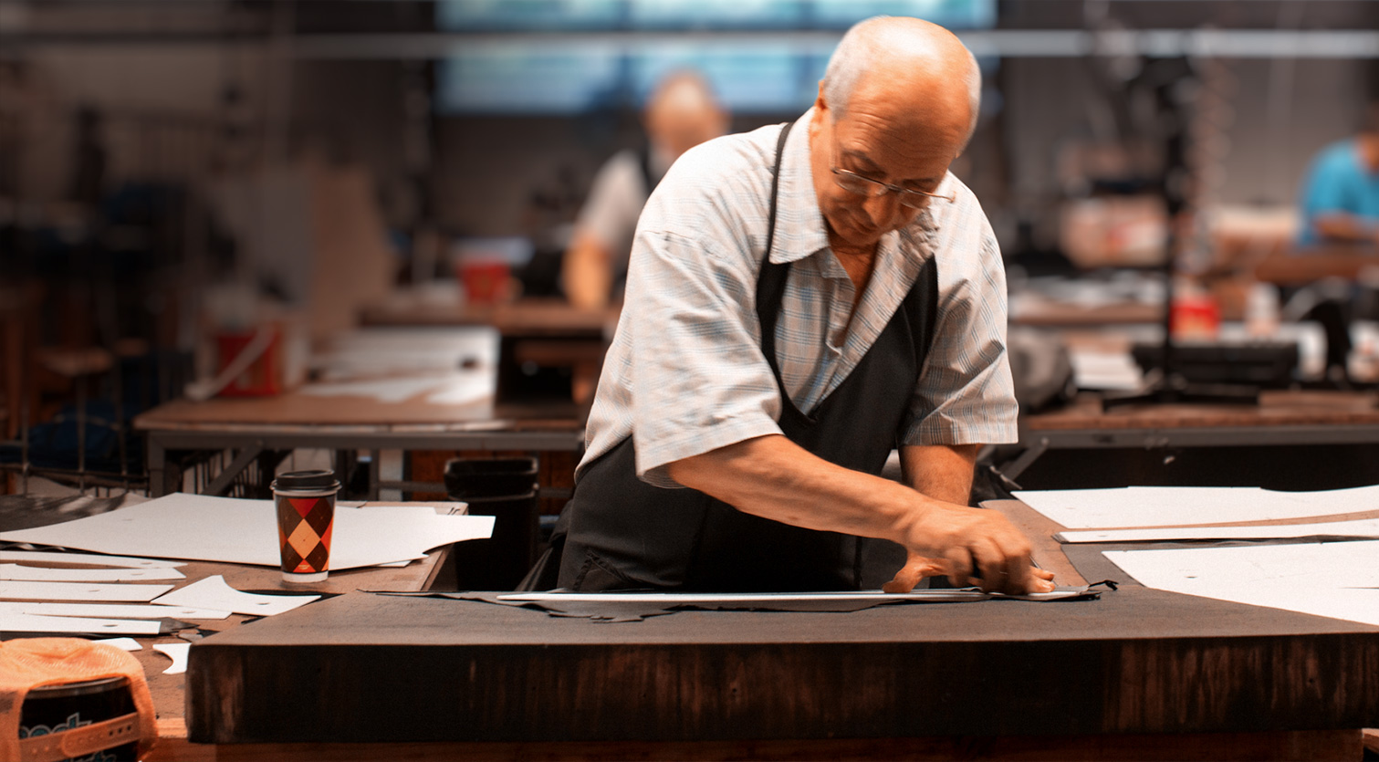 Man cutting leather skin using just a razor blade